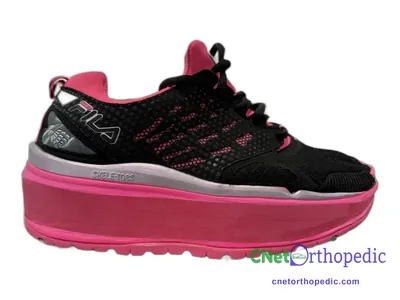 Shoe lift added to a women's black Fila sneaker
