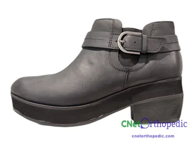 Shoe lift added to a women's grey boot