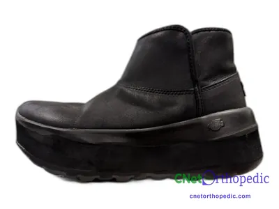 Shoe lift added to a women's black boot
