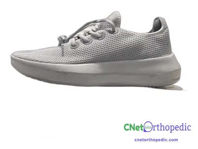 Shoe lift added to a women's grey sneaker