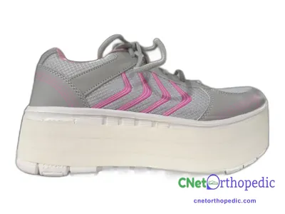 Shoe lift added to a women's grey sneaker