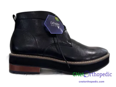 Shoe lift added to a men's black boot