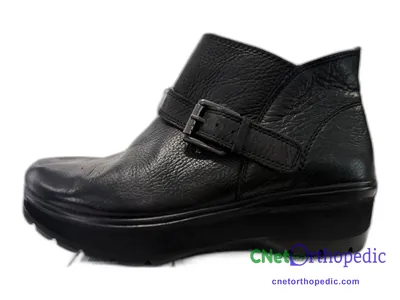 Shoe lift added to a women's black boot