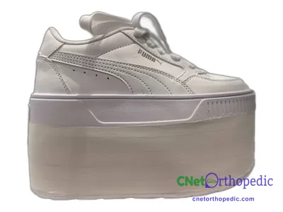 Shoe lift added to a women's grey Puma sneaker