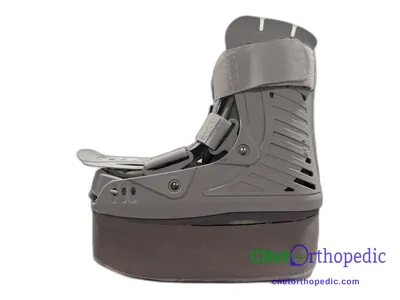 Shoe lift added to a grey boot