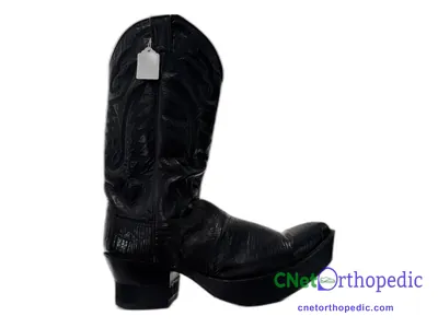 Shoe lift added to a black boot