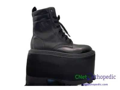 Shoe lift added to a black boot