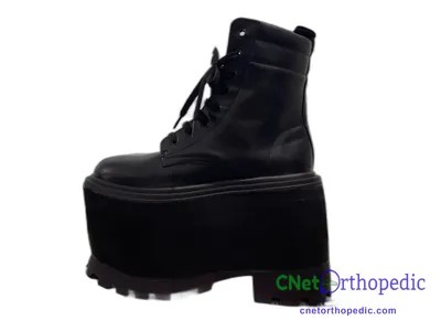 Shoe lift added to a black boot