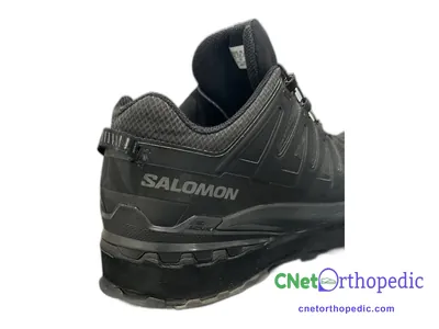 Shoe lift added to a men's black Salomon sneaker
