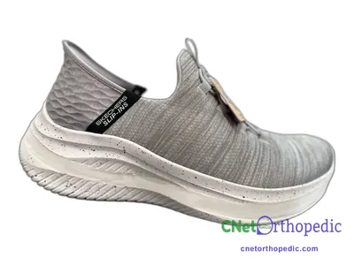 Shoe lift added to a women's grey Skechers sneaker