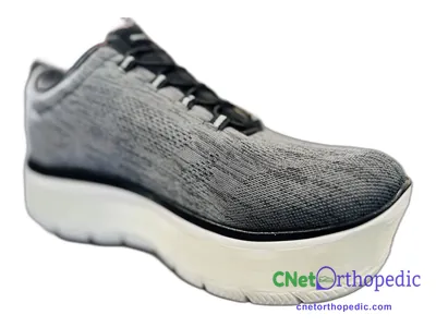 Shoe lift added to a men's grey New Balance sneaker
