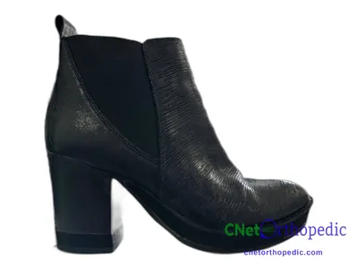 Shoe lift added to a women's black boot