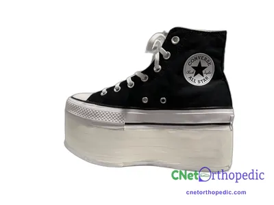 Shoe lift added to a women's black Converse Chuck Taylor sneaker