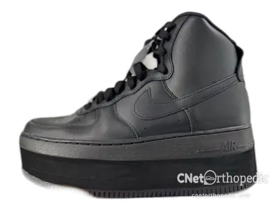 Shoe lift added to a men's grey Nike Air Force 1 sneaker