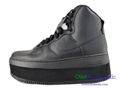 Shoe lift added to a men's grey Nike Air Force 1 sneaker