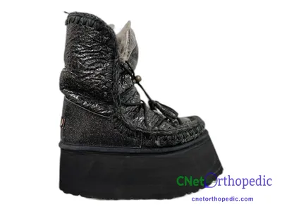 Shoe lift added to a women's black Mou boot