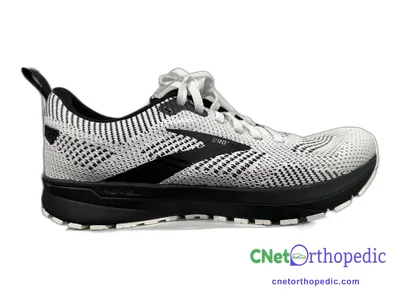 Shoe lift added to a men's white Brooks sneaker