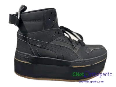Shoe lift added to a men's black Puma sneaker
