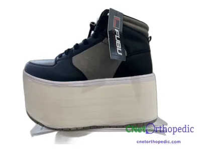 Shoe lift added to a men's black FUBU sneaker