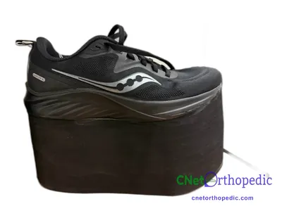 Shoe lift added to a men's black Saucony sneaker
