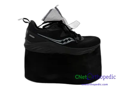 Shoe lift added to a men's black Saucony sneaker