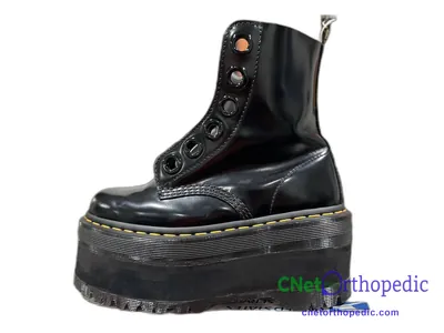 Shoe lift added to a women's black Dr. Martens boot