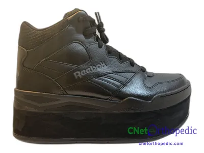 Shoe lift added to a men's grey Reebok sneaker
