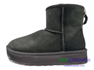 Shoe lift added to a women's black UGG boot