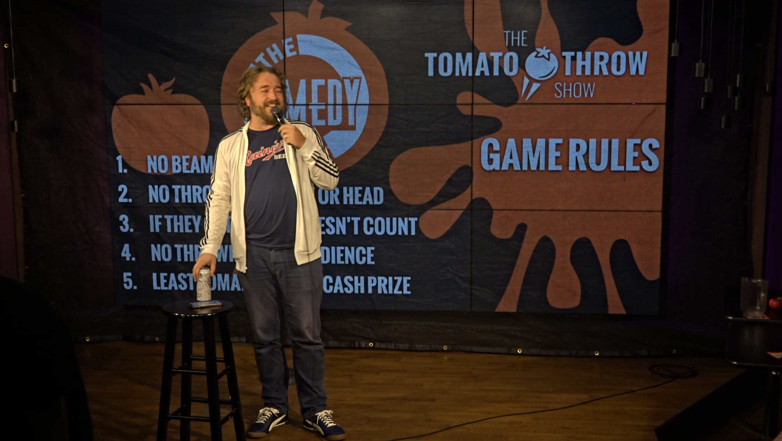 Comedian performing at the Tomato Throw Show at Comedy Bar Chicago