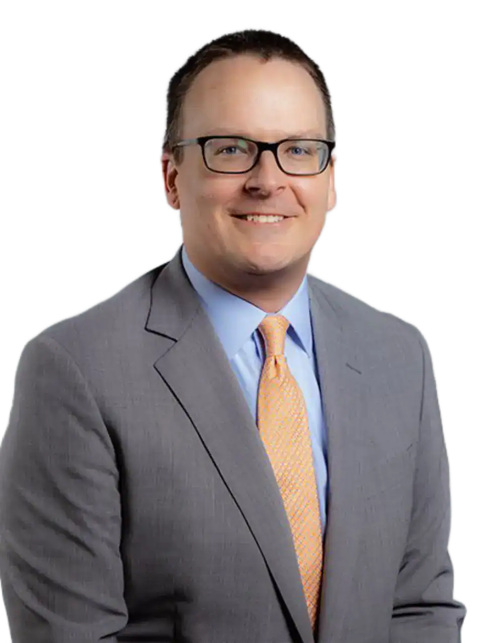 Professional man in gray suit and glasses smiling for business portrait.