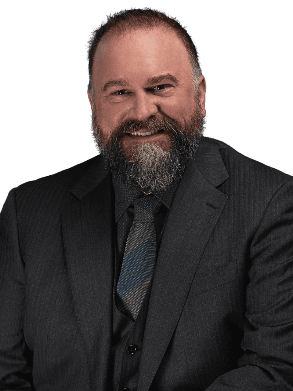 Professional man in suit smiling, representing connection and communication skills.
