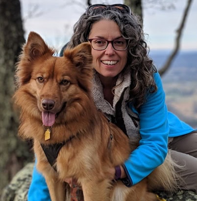 Picture of Sydney Osborne, outside with her dog