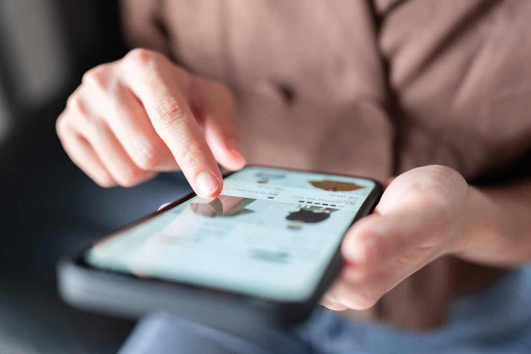 image of a person holding a cell phone