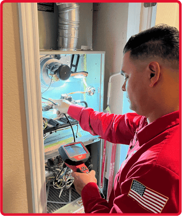 SERVICE-TECH-WORKING-ON-FURNACE