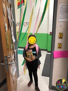 student standing in front of streamers
