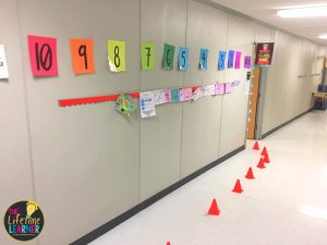 race car posters and cones leading to door