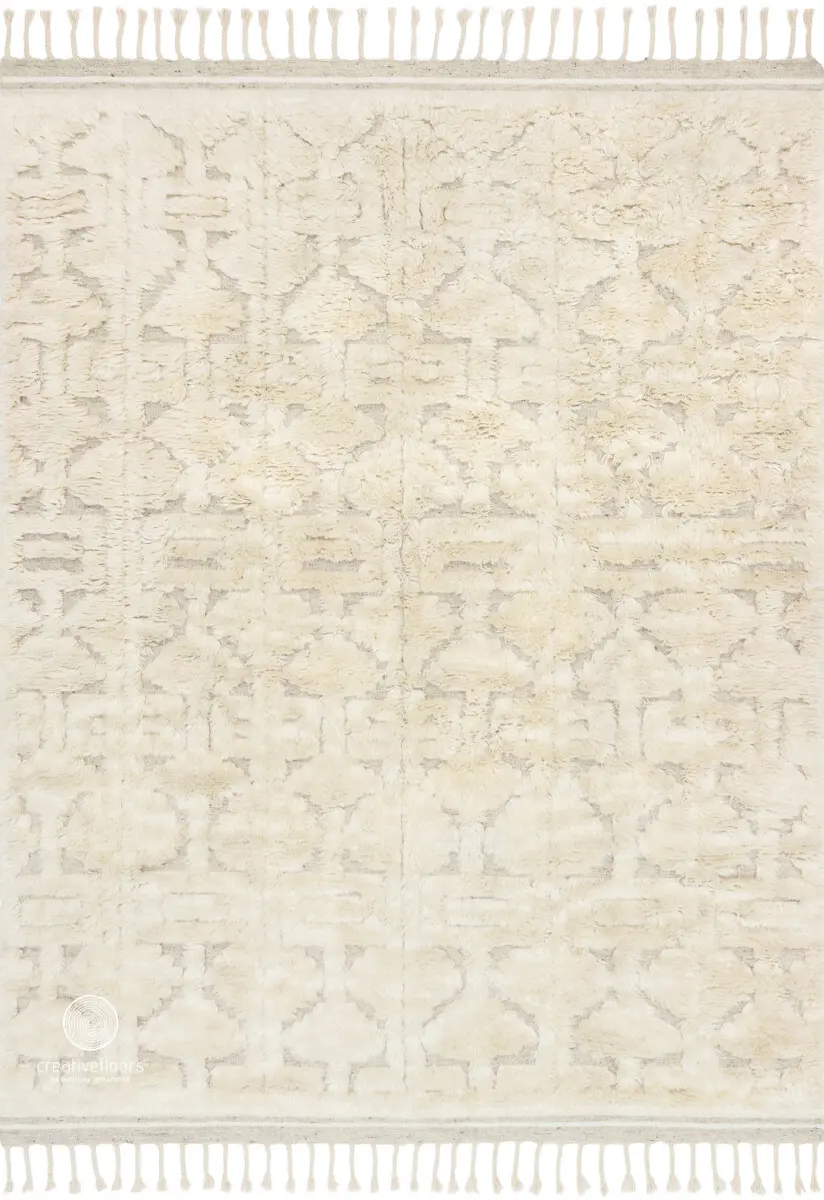 Soft beige textured area rug with intricate pattern, ideal for modern and contemporary living rooms or bedrooms.