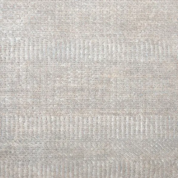 Cream-colored textured area rug with subtle geometric pattern, ideal for interior flooring, providing style and comfort.