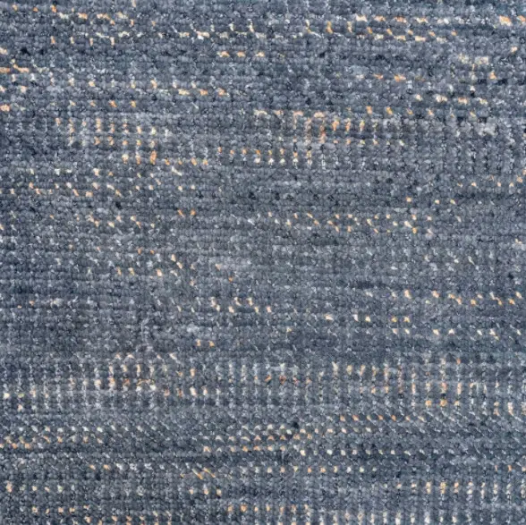 Soft blue patterned carpet with subtle gold accents, ideal for upscale residential or commercial flooring.