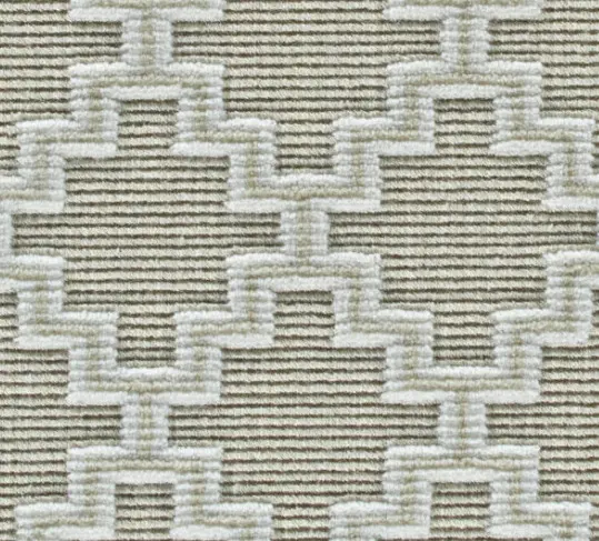Cream and beige geometric patterned area rug with textured design.
