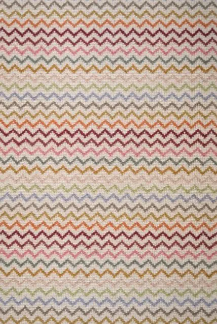 Colorful zigzag carpet pattern with vibrant hues, ideal for custom flooring and interior design in Vail.
