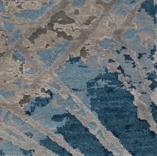 Vibrant blue and gray modern carpet with abstract pattern for stylish interior flooring.