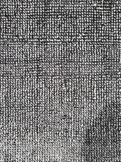 Soft woven carpet texture in black and white for luxury interior flooring.