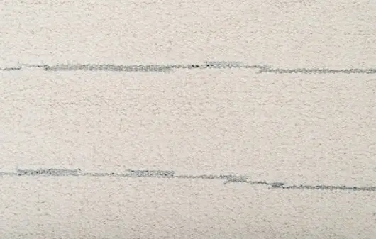 Soft beige textured wall with subtle horizontal lines, ideal for modern interior design.