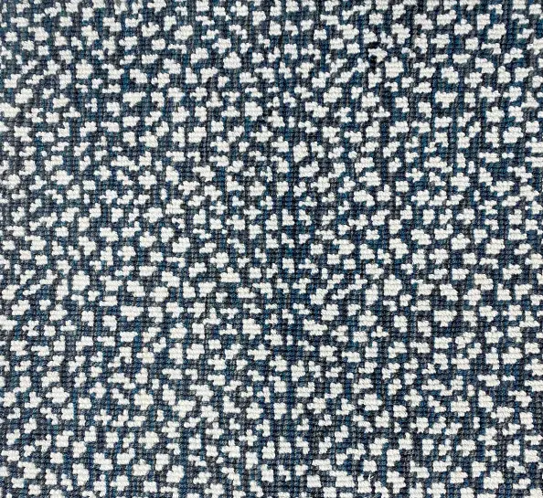 Soft textured carpet with a navy blue and white pattern, ideal for residential and commercial flooring.