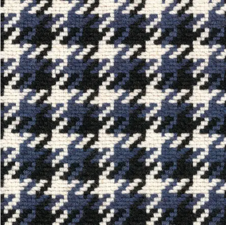 Houndstooth patterned carpet in black, white, and navy; perfect for stylish flooring designs.