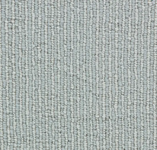 Soft textured beige and gray carpet for residential and commercial flooring needs.