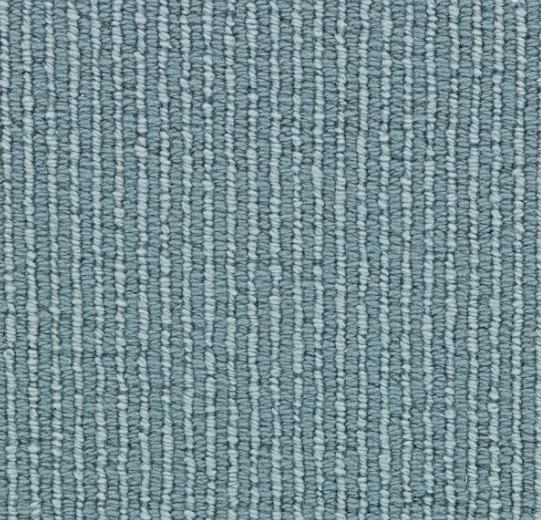 Soft blue textured carpet with linear pattern, ideal for commercial and residential flooring solutions.