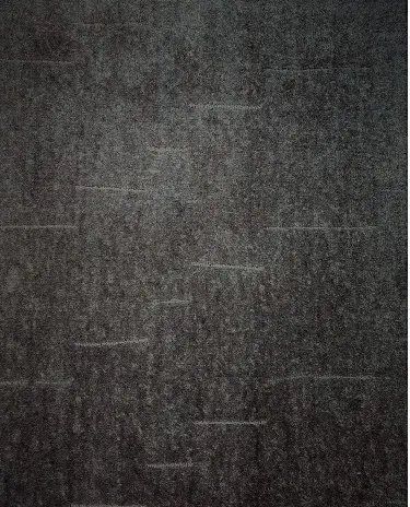 Dark textured flooring with wood grain pattern, ideal for modern interior design.