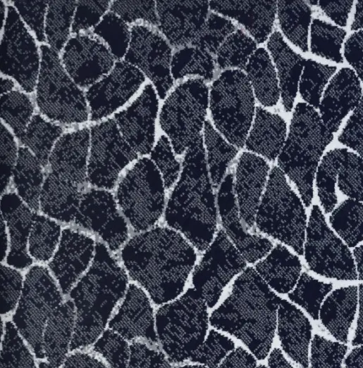 Patterned commercial carpet with navy blue and white abstract circular design for modern flooring.